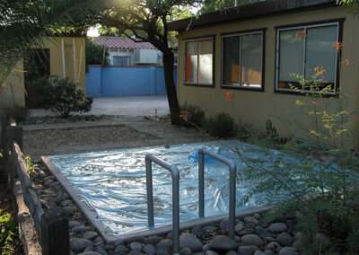 Blue plastic foil, plastic tube, Imitation of a swimming pool in a backyard